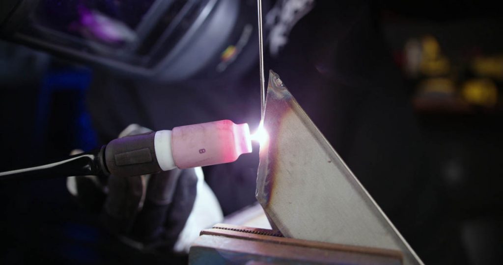 TIG welding vertical up a straight edge clamped in a vice with pulse