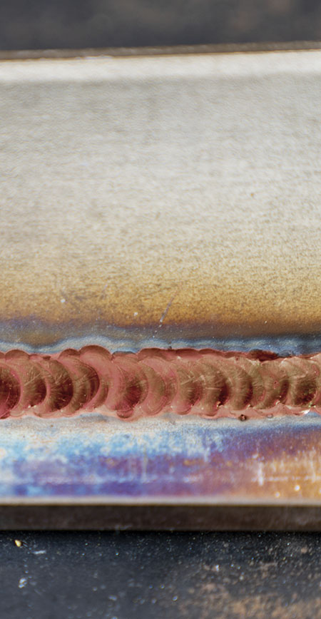 Example of a red coloured TIG weld