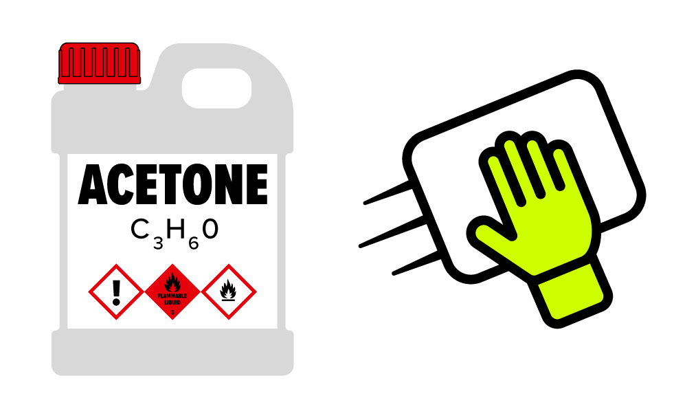 acetone bottle and glove wiping a surface